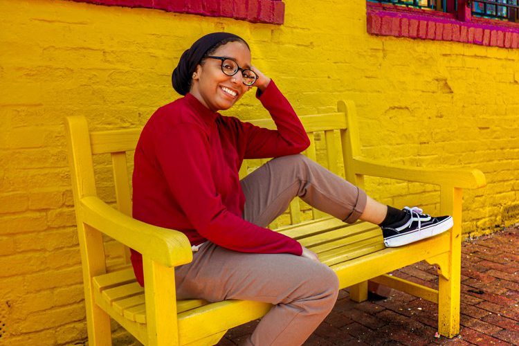 Portrait of woman sitting on bench